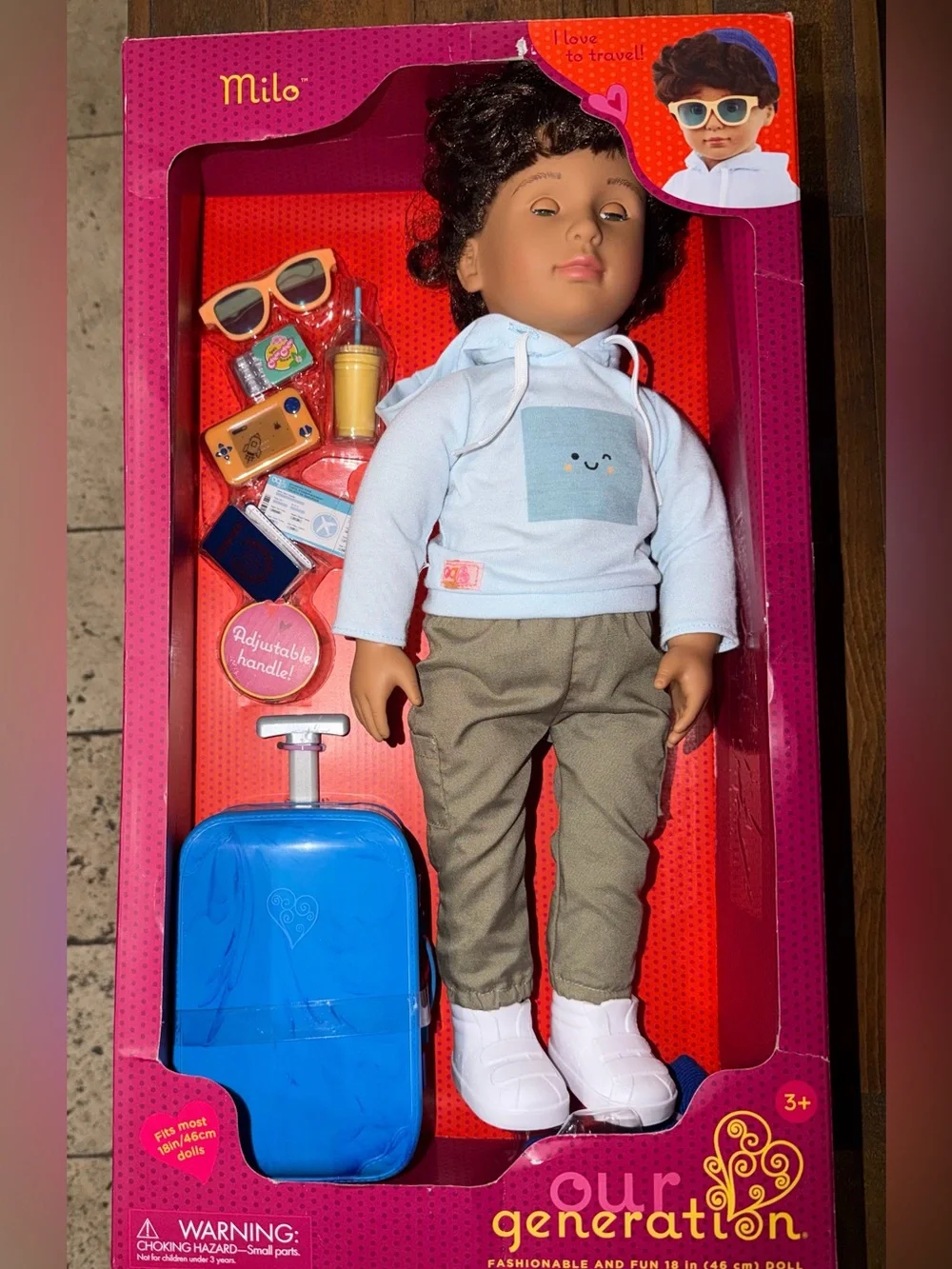 Our Generation Milo Travel Doll with Blue Suitcase and White Hoodie